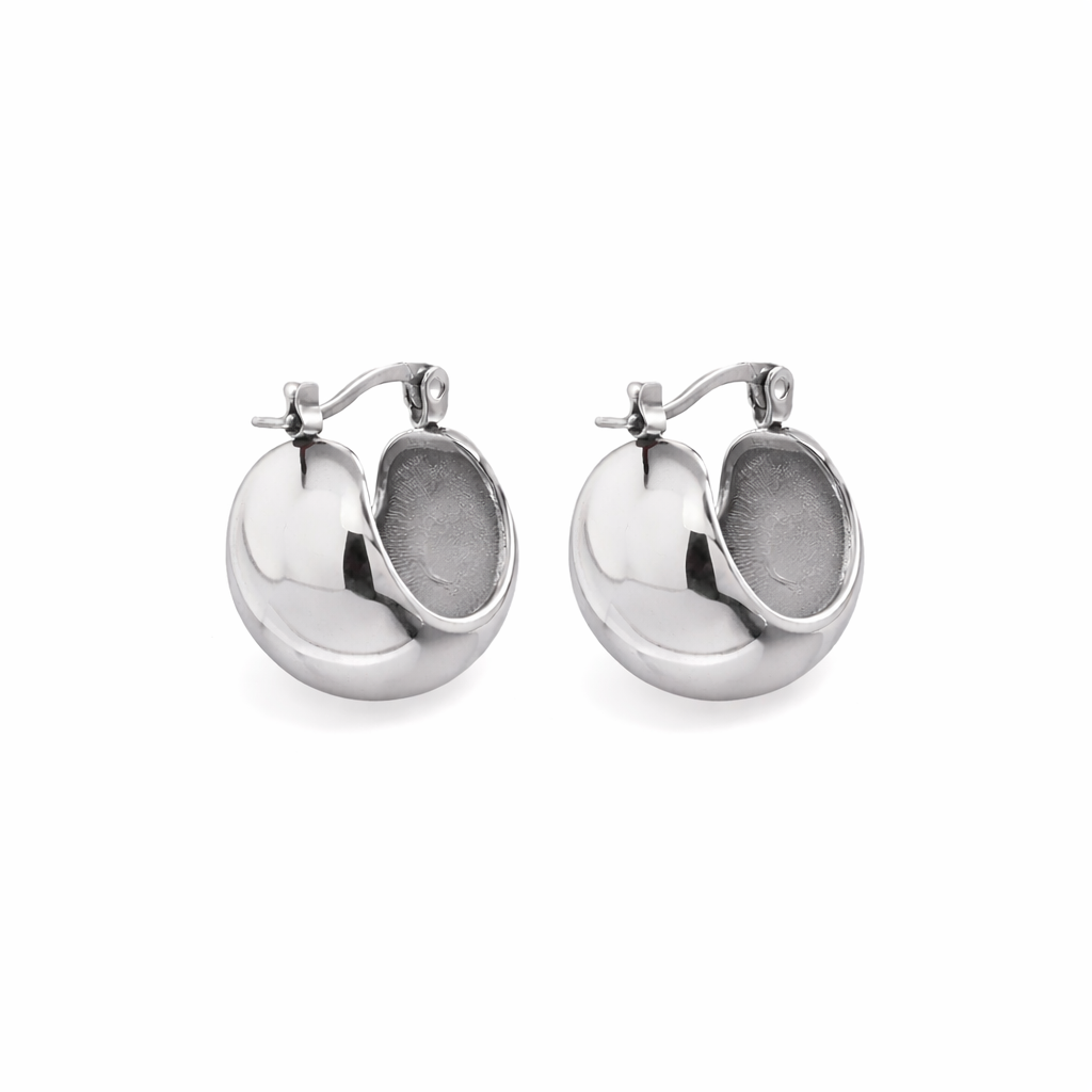 Classic silver huggie hoops designed for everyday wear. Lightweight, minimal and perfect for effortless, layered styling.